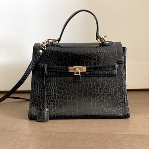 Black fake crocodile leather purse with long strap and gold details
